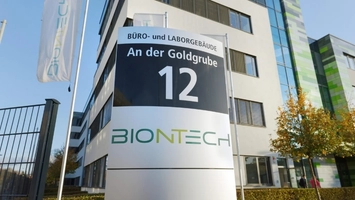 BioNTech office and laboratory building sign displaying address 12 outside a modern corporate campus